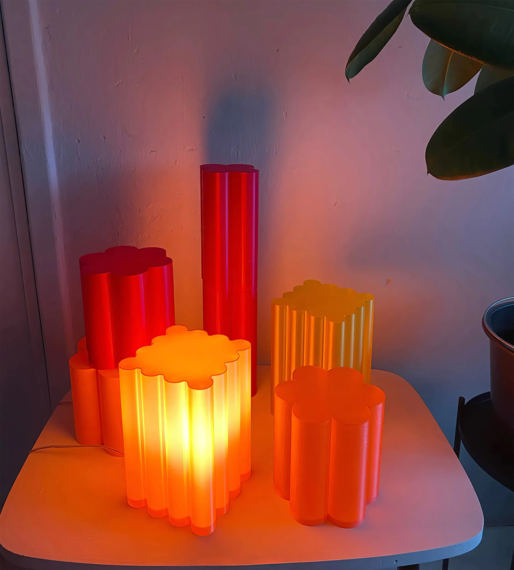 Boole sculptural table lamps, 3D-printed from eco-friendly PLA plastic. Their ribbed, petal-like forms diffuse light softly, creating an ambient glow. Inspired by modernist architecture and organic shapes, these statement lamps blend art and functionality. Available in various colors and sizes. Worldwide shipping from Germany. For inquiries and orders, contact us on WhatsApp.